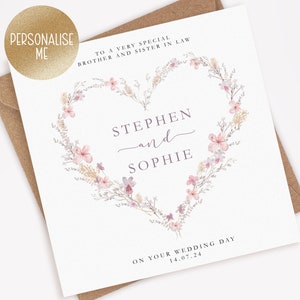 May include: A wedding card featuring a floral heart design. The card reads "To a very special brother and sister in law, Stephen and Sophie, on your wedding day 14.07.24".