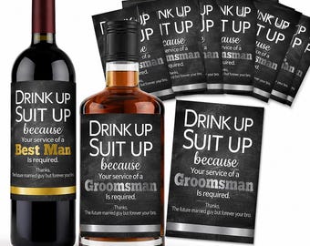 May include: Two bottles of liquor and several cards with the text "DRINK UP SUIT UP" in white lettering. One bottle is wine, the other is a liquor bottle. The cards and bottles have text that says "Best Man" and "Groomsman".