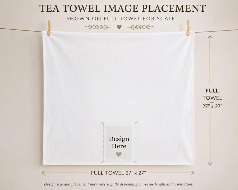 a white towel hanging on a clothesline, with a design for a towel image placed on it. The towel is described as a "full towel" and has dimensions of 27 inches by 27 inches. The towel is shown on a wall, and there is a text box with a heart symbol in the center of the towel.
