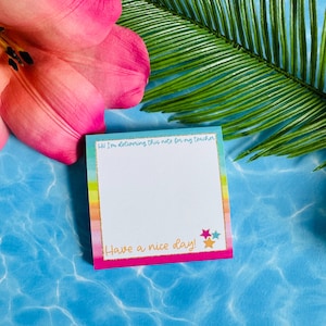May include: A square sticky note with a rainbow gradient border and a gold glitter frame. The top text reads Hi I'm delivering this note for my teacher and the bottom text reads Have a nice day! with three small colorful stars in the corner.
