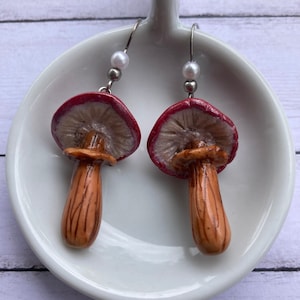 Red and white  mushroom dangle earrings. Cottage core, goblin core.