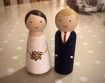 Personalised peg doll bride and groom wedding cake toppers