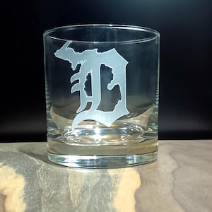 May include: A clear glass tumbler with a frosted etching of the letter "D" in the shape of the state of Michigan.