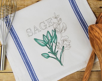 May include: White kitchen towel with blue stripes and an embroidered sage plant with the word "SAGE" in a stylized font.
