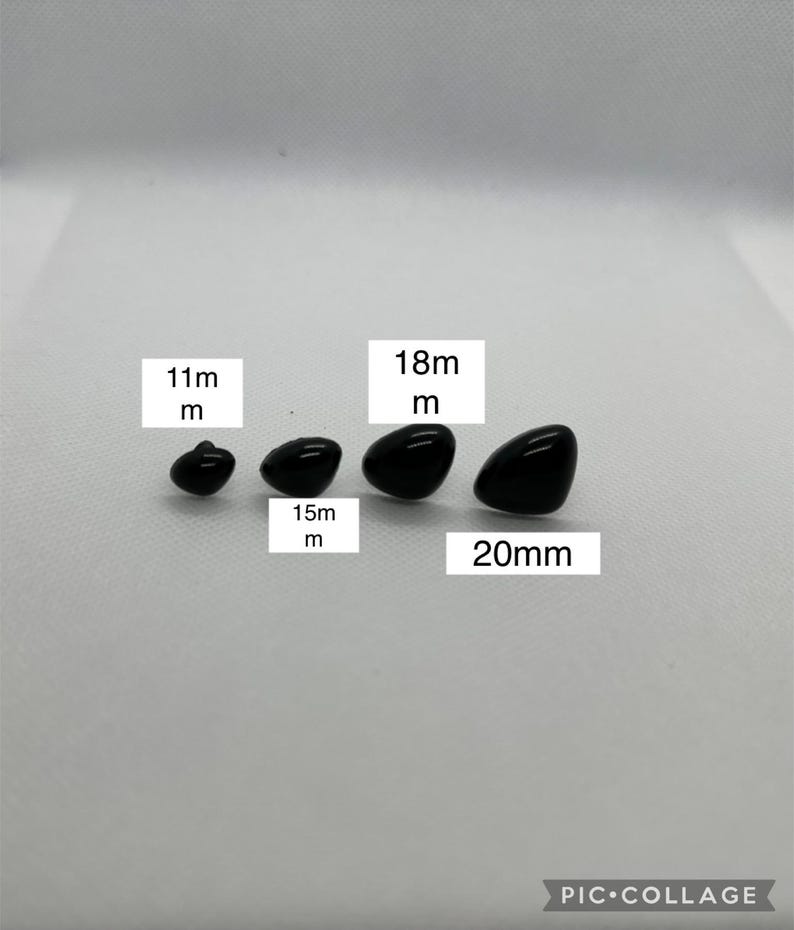 May include: Four black plastic safety eyes in different sizes: 11mm, 15mm, 18mm, and 20mm. These eyes are commonly used for plush toy making and craft projects.