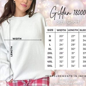 May include: Size chart for Gildan 18000 heavy blended crewneck sweatshirt. The chart shows measurements in inches for sizes S through 5XL, including width, length, and sleeve length.