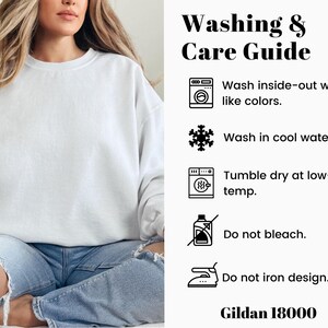 May include: Washing and care instructions for a Gildan 18000 sweatshirt. The instructions include washing inside-out with like colors, washing in cool water, tumble drying at low temperature, not bleaching, and not ironing the design.