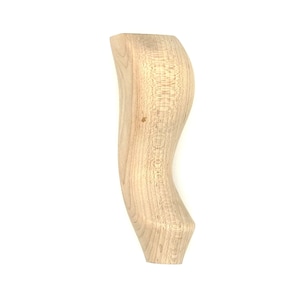 May include: A wooden furniture leg with a curved design. The leg is unfinished and has a natural wood color.