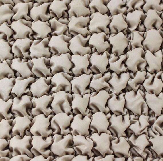 Textured quilted padded fabric by the yard