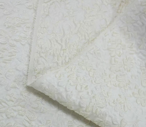 Shimmery embossed jacquard silk fabric by the yard