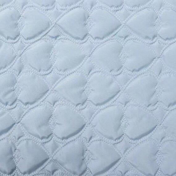 Textured quilted padded fabric by the yard