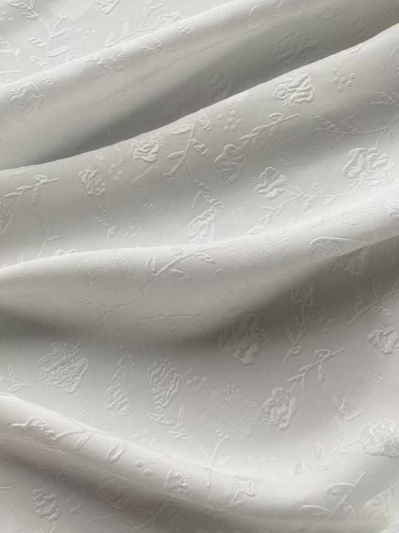 Jacquard embossed silk fabric