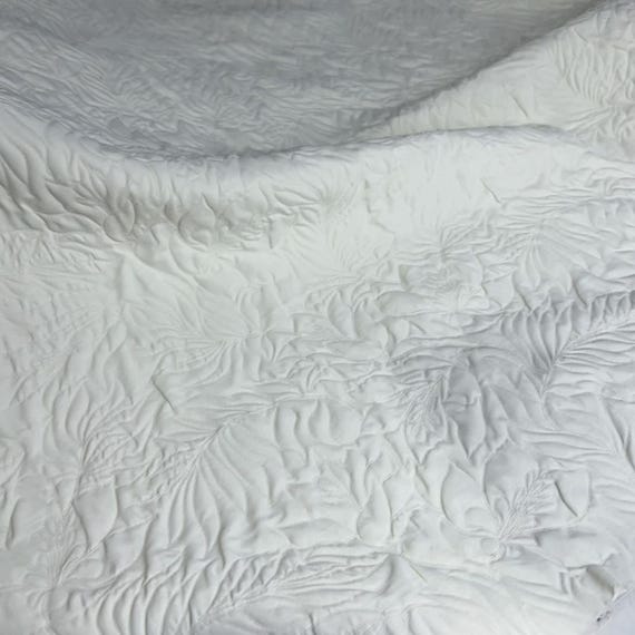 Embroidered Textured quilted padded triacetate fabric by the yard
