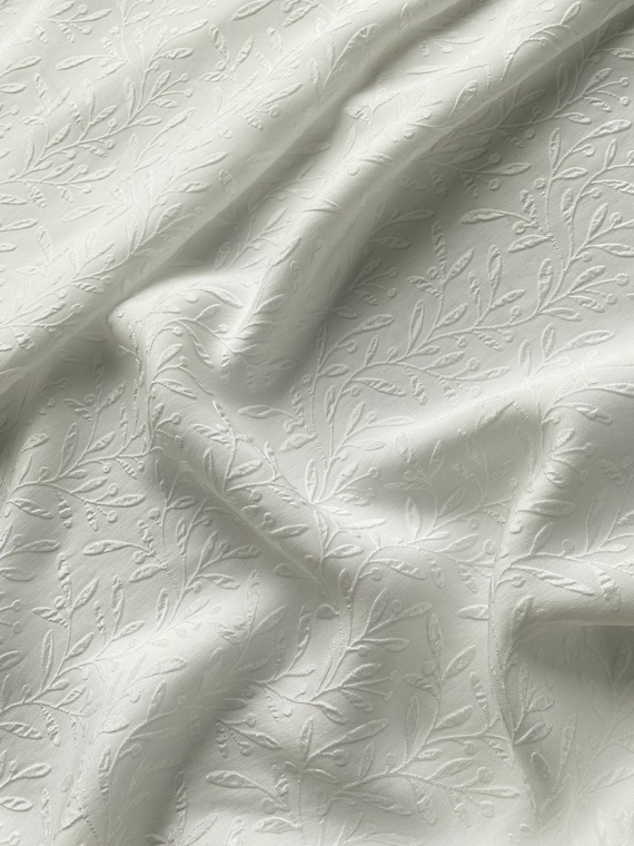 Jacquard embossed silk fabric