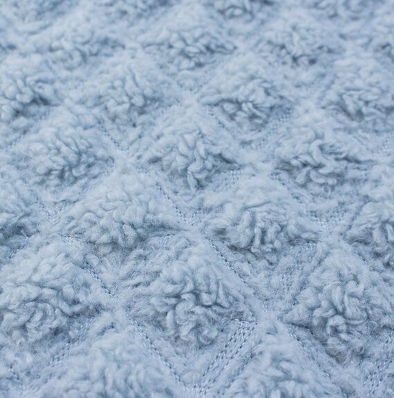 Textured quilted padded fabric by the yard