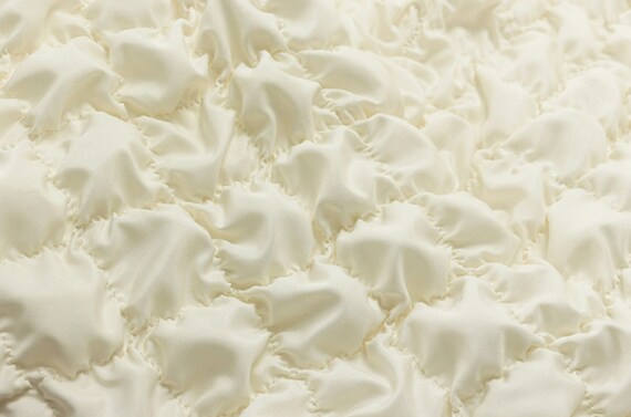 Textured quilted padded fabric by the yard