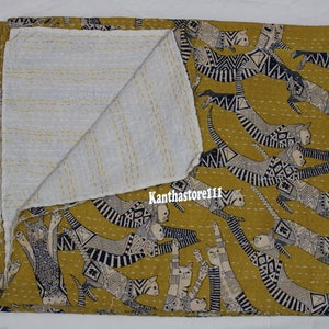 May include: A yellow kantha quilt with a white cotton backing. The quilt features a repeating pattern of black and white stylized cats.
