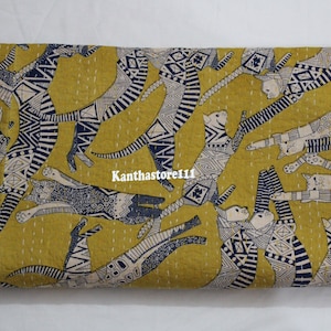 May include: A yellow fabric with a repeating pattern of black and white stylized cats. The cats are drawn in a geometric style with a variety of patterns and designs. The fabric is perfect for quilting, sewing, or crafting.
