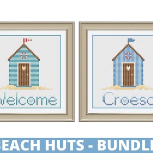 May include: Two framed cross-stitch patterns of beach huts. The first hut says "Welcome" and the second hut says "Croeso".