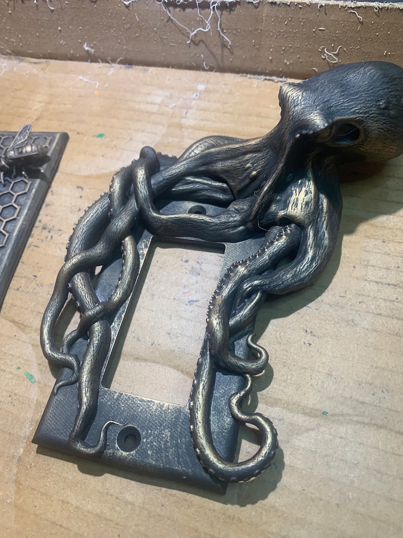 Octopus Lichtschalterplatte Bronze Rocker