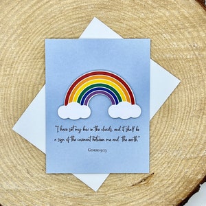 May include: A blue card with a rainbow and clouds. The card has the text "I have set my bow in the clouds, and it shall be a sign of the covenant between me and the earth" and "Genesis 9:13".