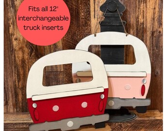 May include: Two wooden camper-shaped decorations in red and pink with white and gray accents. The red camper has white polka dots. The text "Fits all 12" interchangeable truck inserts" is in a red circle.