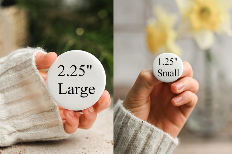 May include: Two white round buttons are displayed. One is labeled "2.25" Large" and the other is labeled "1.25" Small". The buttons are held in hands, with a blurred background of greenery and flowers.