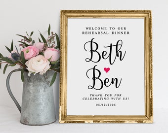 May include: A gold-framed sign with white background and black text announcing a rehearsal dinner for Beth and Ben. The sign includes the date 05/12/2025.