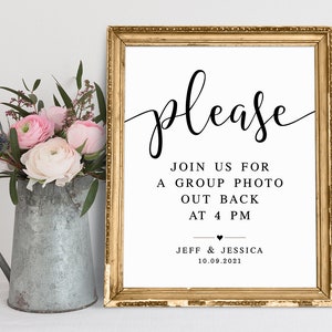 May include: A white sign with black text in a gold frame. The sign says "please join us for a group photo out back at 4 pm Jeff & Jessica 10.09.2021".