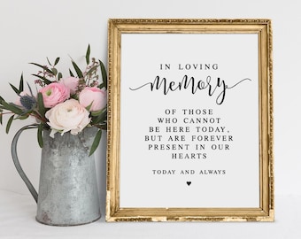 May include: A gold framed sign with the text "In Loving Memory" and a message about those who cannot be here today but are forever present in our hearts. The sign also says "Today and Always".