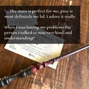 May include: A wooden wand with a dark finish and red accents. The wand has a twisted handle and is lying on a wooden surface. The image also includes a certificate with text about the wand's properties.