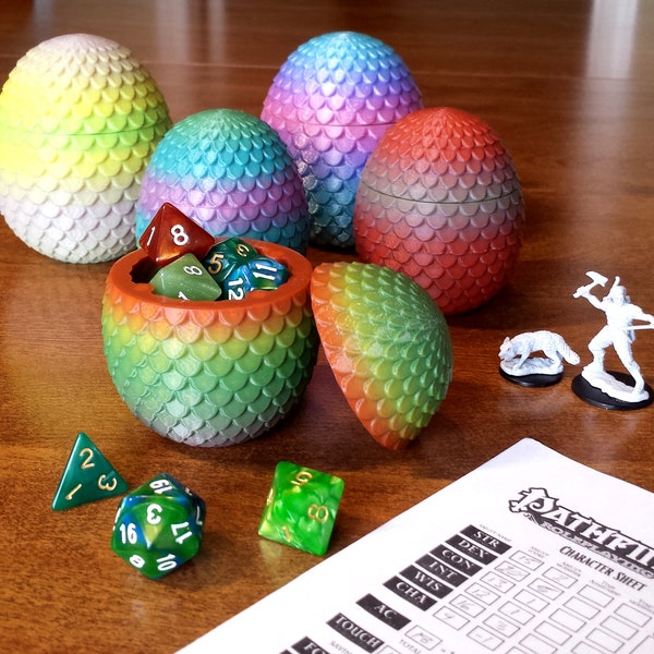 Boîte à dés D&D - Boîte à dés uf de dragon avec écailles en forme de larme et dégradé aléatoire. Rangez vos dés Donjons et Dragons avec style !