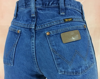 Vaqueros Wrangler Western vintage, talla 30x33, cintura alta desgastada.