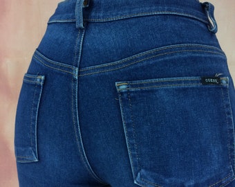 Pantalones acampanados vintage de Guess, talla 27, mezclilla elástica azul oscuro.