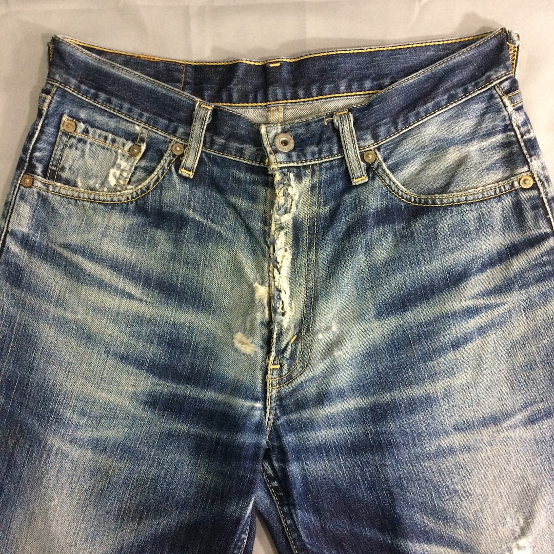 Jeans Levis 502 vintage: denim strappato con lavaggio medio anni
