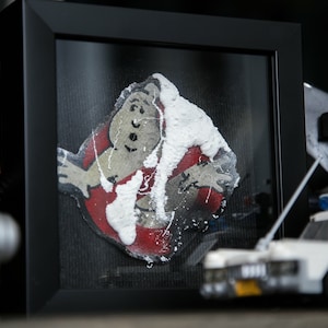 Ghostbusters Battle Damaged Patch Replica in Gallery Frame