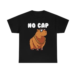 May include: Black t-shirt with a white graphic of a capybara wearing sunglasses and a gold chain. The text "NO CAP" is above the capybara.