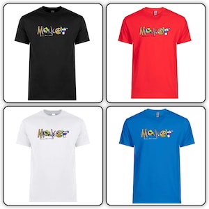 May include: Four t-shirts in different colors, black, red, white, and blue, with the word "Maker" spelled out in colorful letters with images of tools and art supplies. The text below the word "Maker" says "Making Dreams Come True".