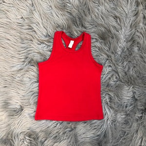 May include: A red sleeveless tank top with a racerback style.