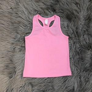 May include: A pink sleeveless tank top with a racerback style.