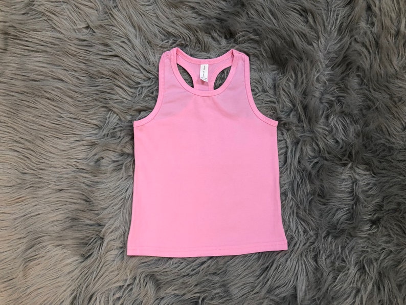 May include: A pink sleeveless tank top with a racerback style.