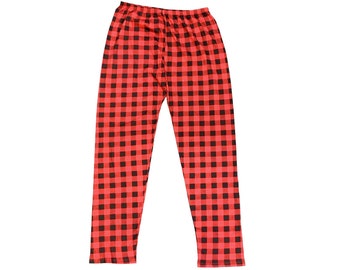 May include: Red and black plaid pajama pants. The pants have a classic buffalo check pattern. The fabric appears to be soft and lightweight, suitable for sleepwear or lounging. The pants are shown on a white background.