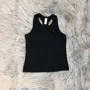 May include: A black racerback tank top with a scoop neck.
