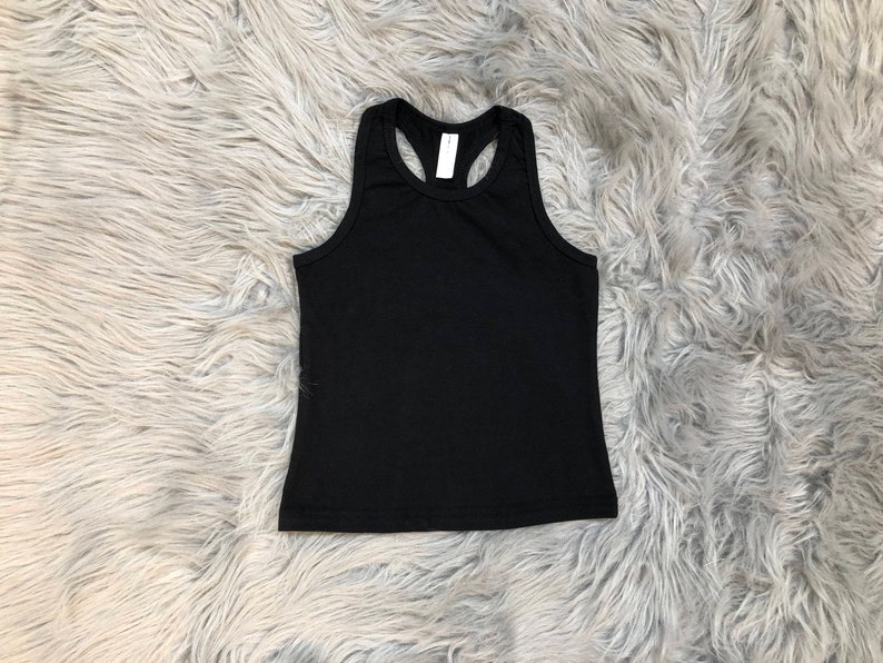 May include: A black racerback tank top with a scoop neck.