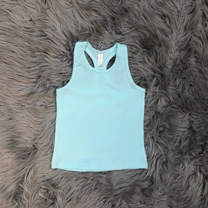 May include: A light blue sleeveless tank top with a racerback design.