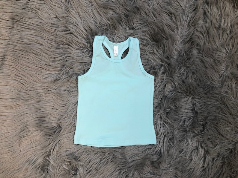 May include: A light blue sleeveless tank top with a racerback design.