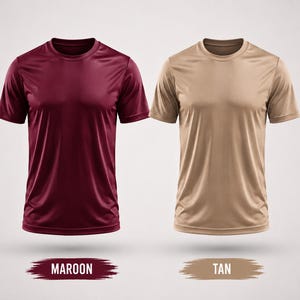 May include: Two short-sleeved crew neck t-shirts displayed side by side. The left shirt is a solid maroon color, and the right shirt is a solid tan color. Below each shirt is a brushstroke graphic with the text MAROON and TAN respectively.