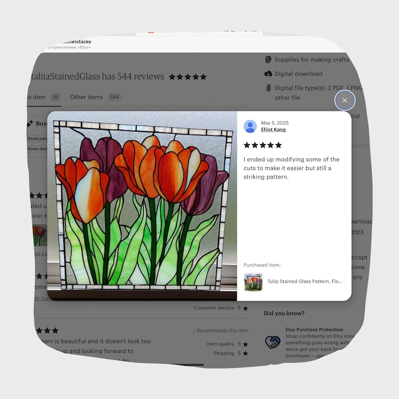 May include: A stained glass pattern featuring a bouquet of orange and purple tulips with green leaves. The pattern is framed in a white border. The pattern is titled "Tulip Stained Glass Pattern, Floral".