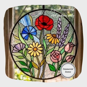 May include: A round stained glass window featuring a colorful floral design. The window includes red poppies, blue cornflowers, yellow daisies, and pink roses. The text "Digital download PDF pattern only" is visible.