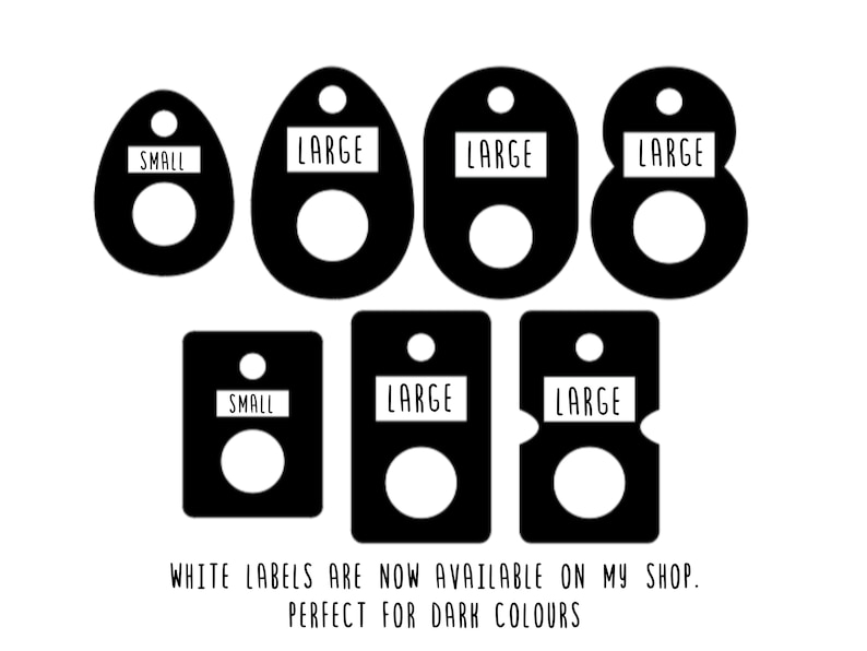 May include: Black labels in various shapes, each with a white center circle and a small white rectangle at the top. The rectangles read "SMALL" or "LARGE". Text at the bottom says "WHITE LABELS ARE NOW AVAILABLE ON MY SHOP. PERFECT FOR DARK COLOURS."